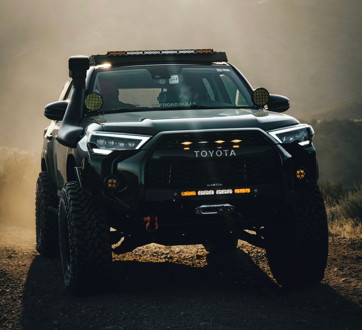 Toyota off-road vehicle on a dusty trail